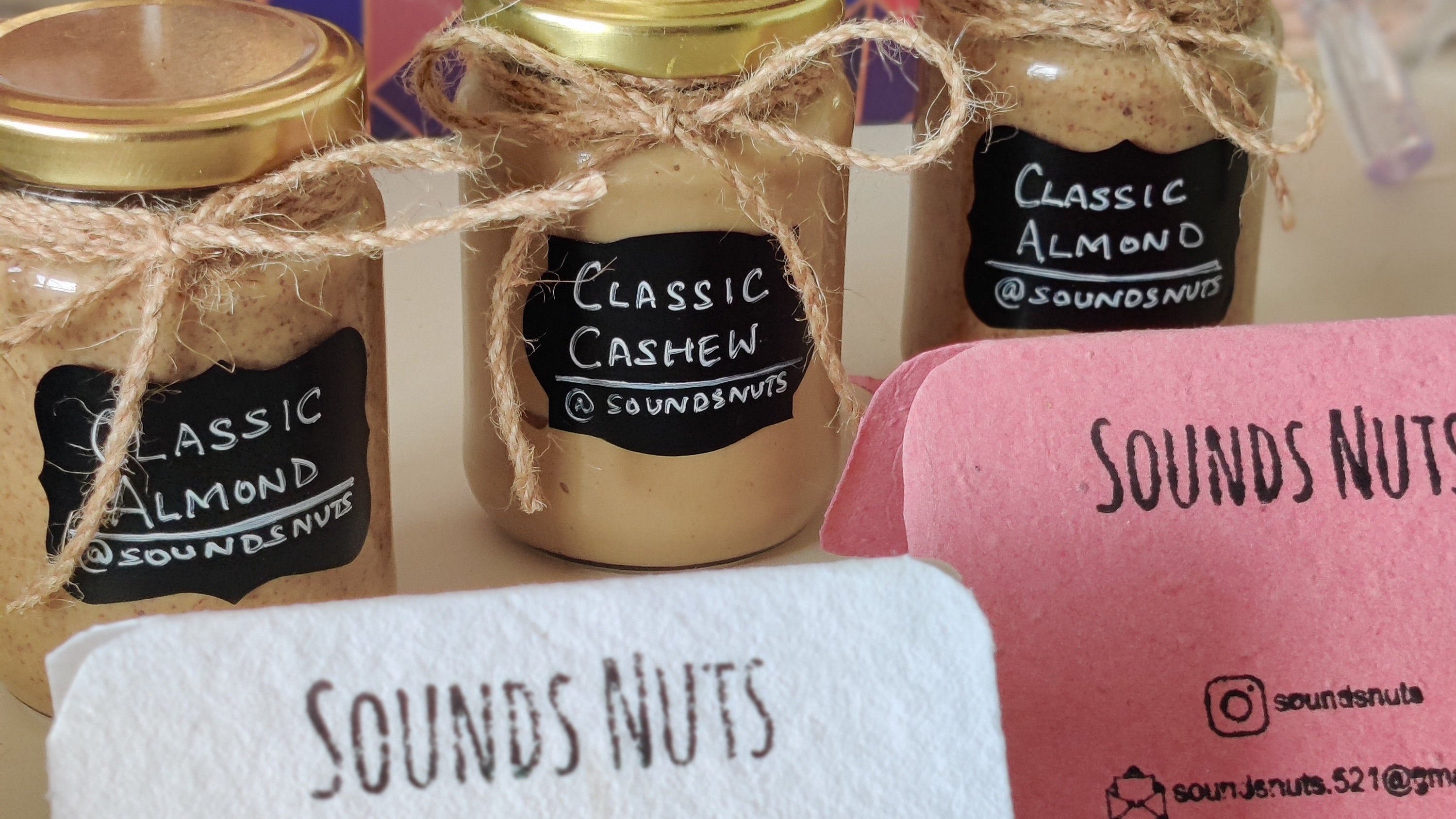 Jars of 'Sounds Nuts' classic almond and cashew nuts with branded napkin and box.